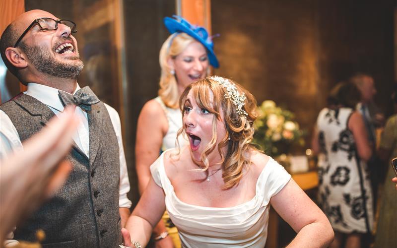 Richard Parsons Gloucestershire Magician | Whitewed Directory Approved Wedding Entertainment Magic Circle Gloucestershire South West UK surprised bride groom with tricks