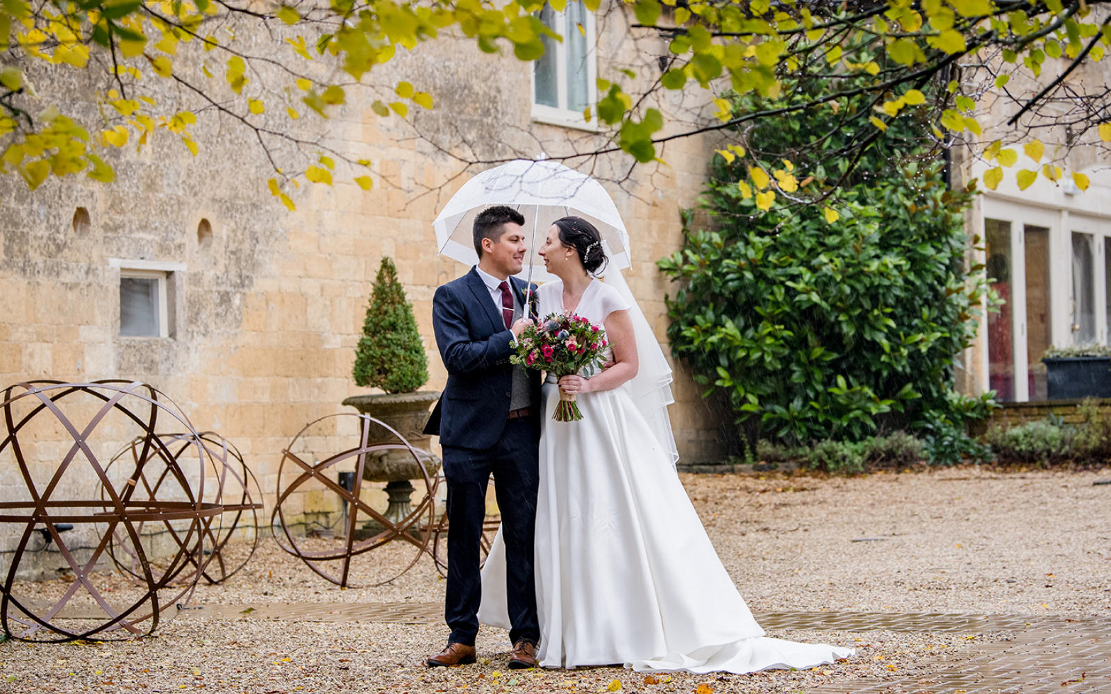 Capture Every Moment wedding photography duo from Cirencester reportage traditional photographers Lapstone Barn Chipping Campden Cotswolds venue Bride Groom Umbrella