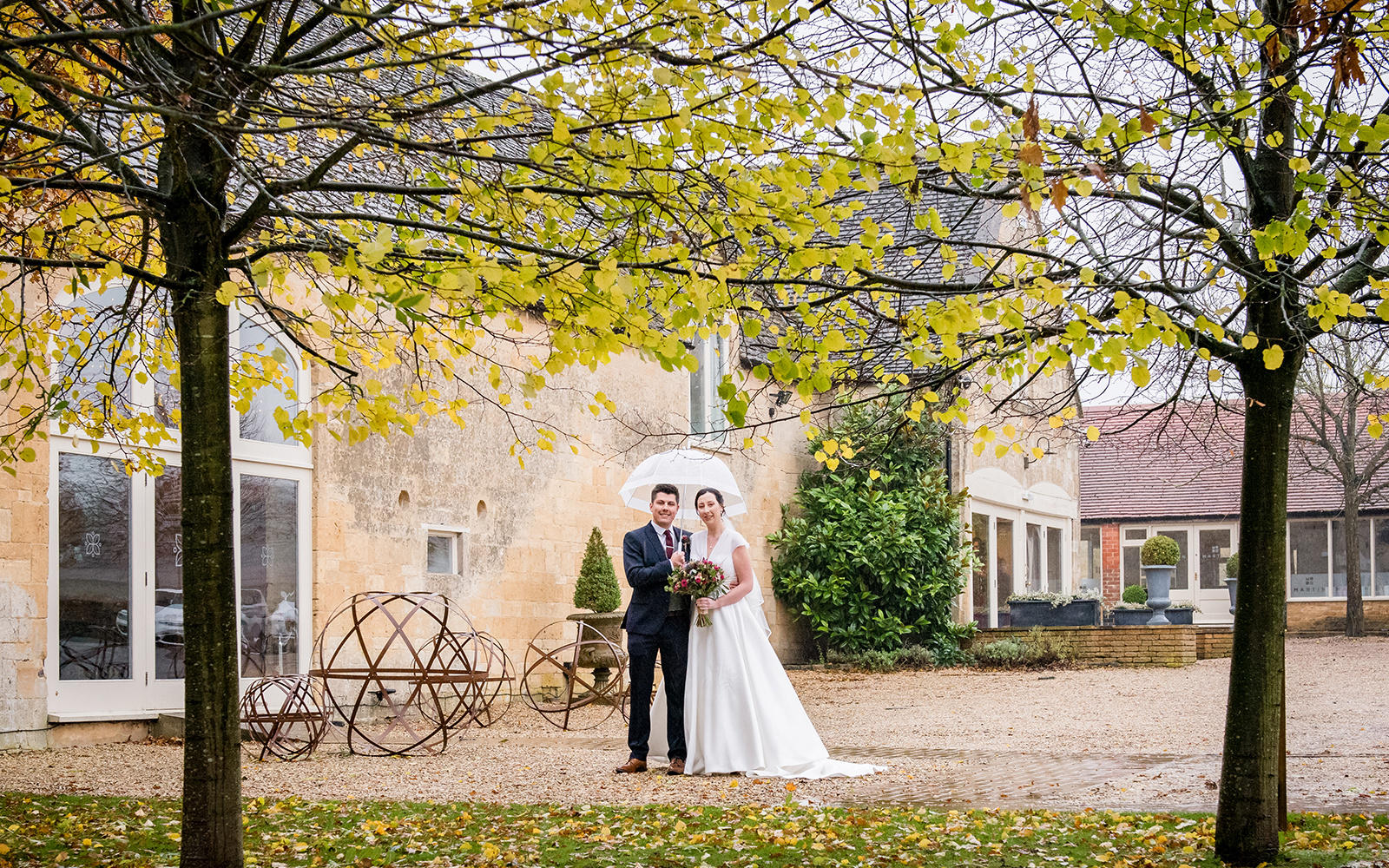 Capture Every Moment wedding photography duo from Cirencester reportage traditional photographers Lapstone Barn Chipping Campden Cotswolds venue Bride Groom Umbrella