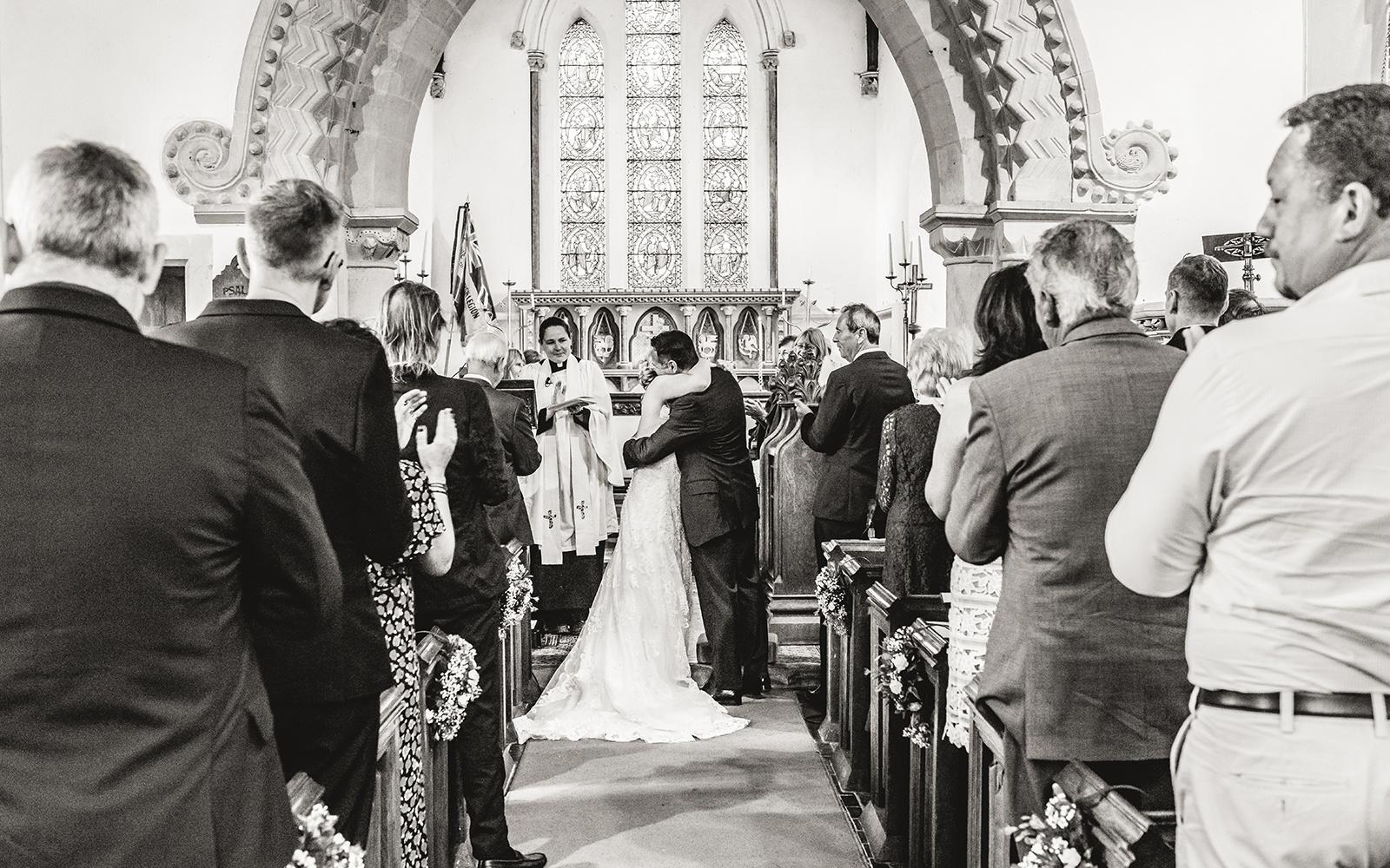 Real Wedding Capture Every Moment Cirencester photography duo wedding photographer  black and white photograph first kiss