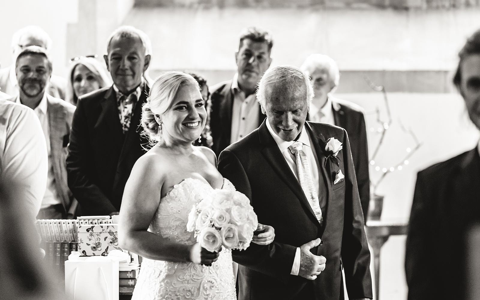 Real Wedding Capture Every Moment Cirencester photography duo wedding photographer  walking down the aisle