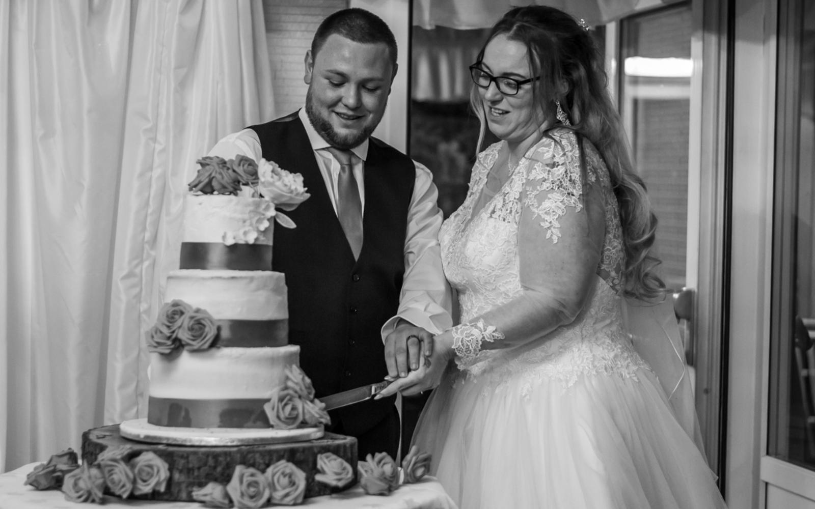 Real Wedding Whitewed Directory approved photographer Strike A Pose Photography Grasmere House Hotel Salisbury bride groom cutting cake