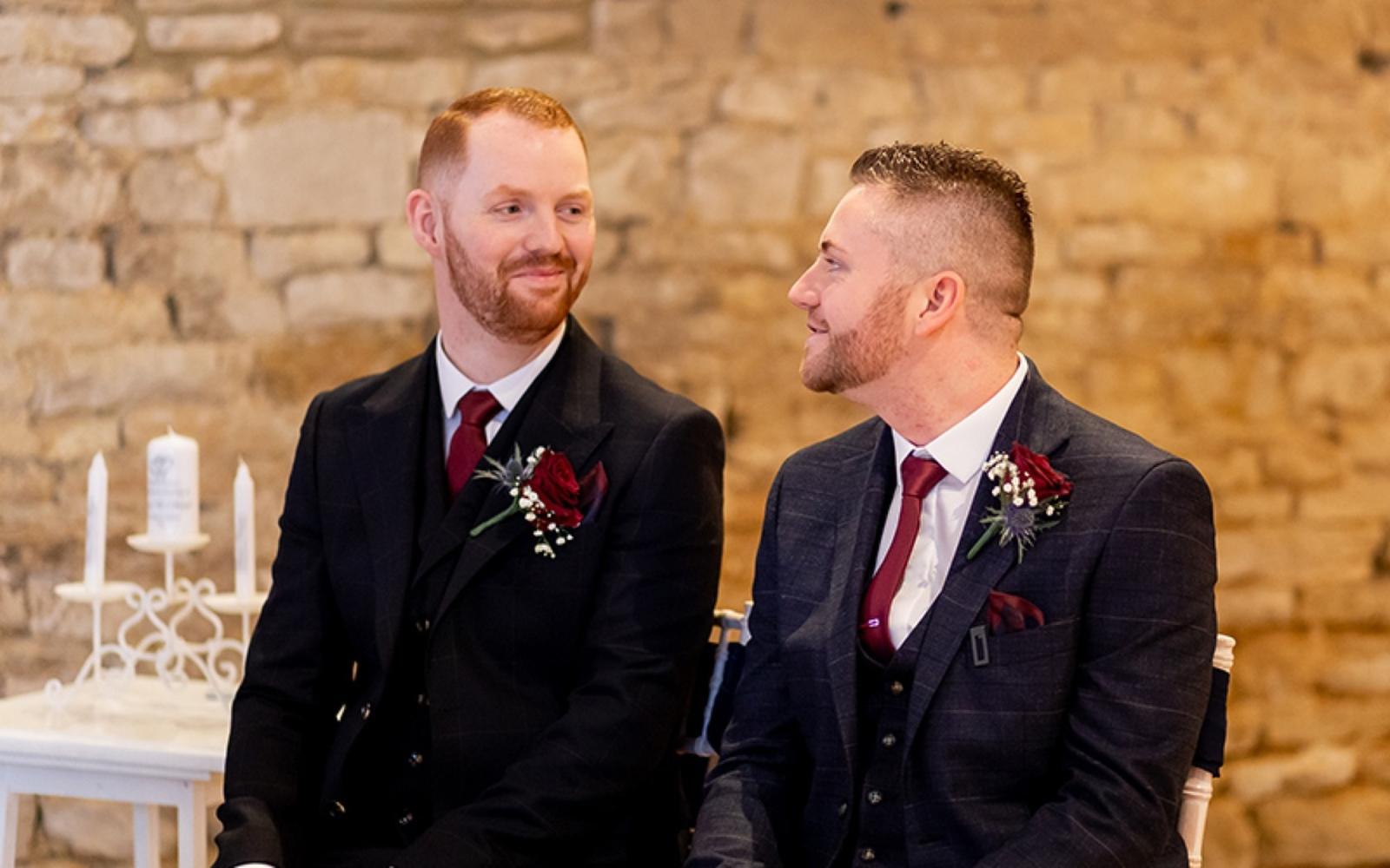Copper & Blossom Real wedding Photography Wiltshire The Great Tythe Barn Tetbury ceremony deep red rose button holes