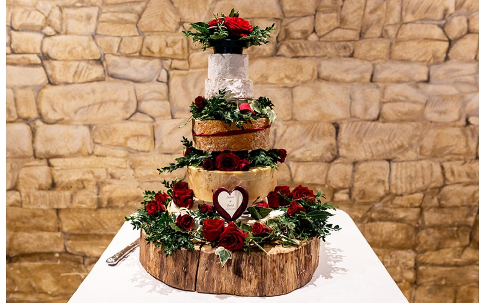 Copper & Blossom Real wedding Photography Wiltshire The Great Tythe Barn Tetbury cheese cake red roses log round cakeboard