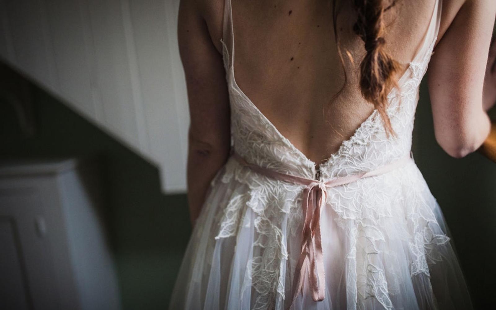 Low back wedding gown with blush ribbon