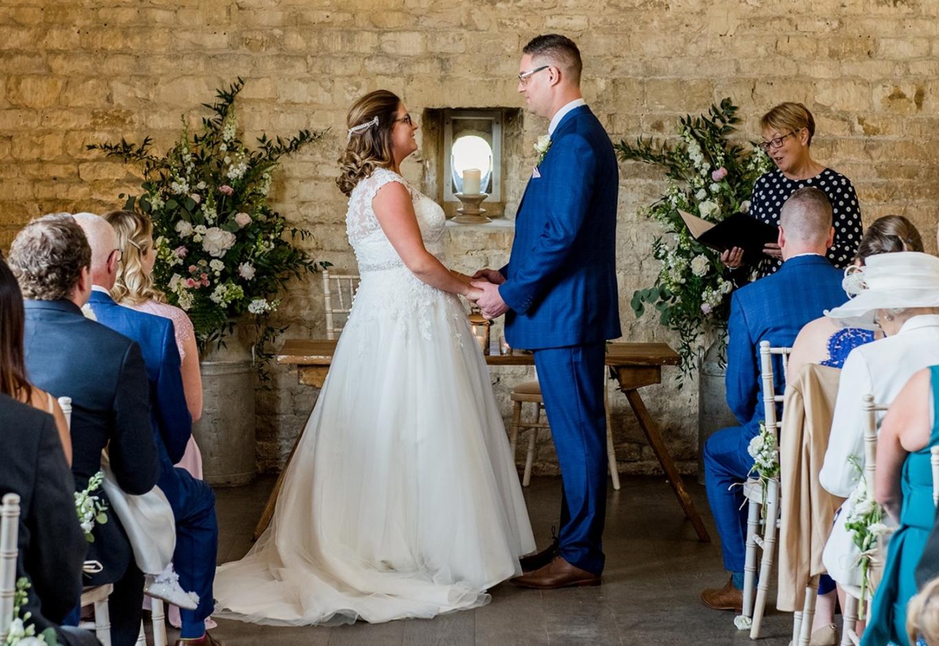 Capture Every Moment wedding photography duo from Cirencester reportage and traditional photographers Lapstone Barn Chipping Campden Cotswolds venue taking their vowels saying I do