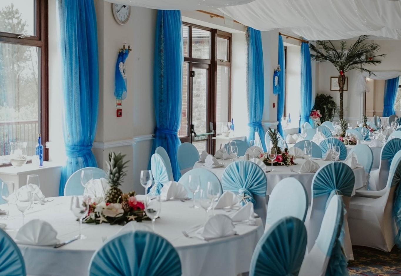 Wrag Barn Golf and Country Club wedding venue Highworth Swindon Wiltshire fully licensed for civil ceremonies sea blue ruffled chair sashes by The Event Dreser Joanna Brooks Photography