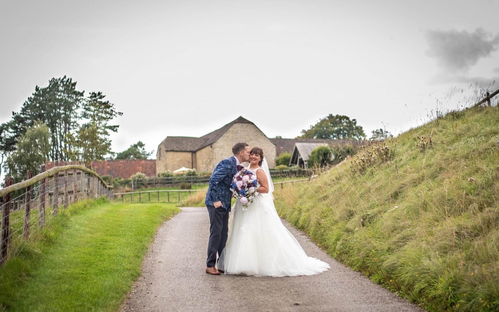 Real Wedding Strike A Pose Photography Wiltshire wedding photographer Kingscote Barn Tetbury Gloucestershire acres of land large bridal bouquet