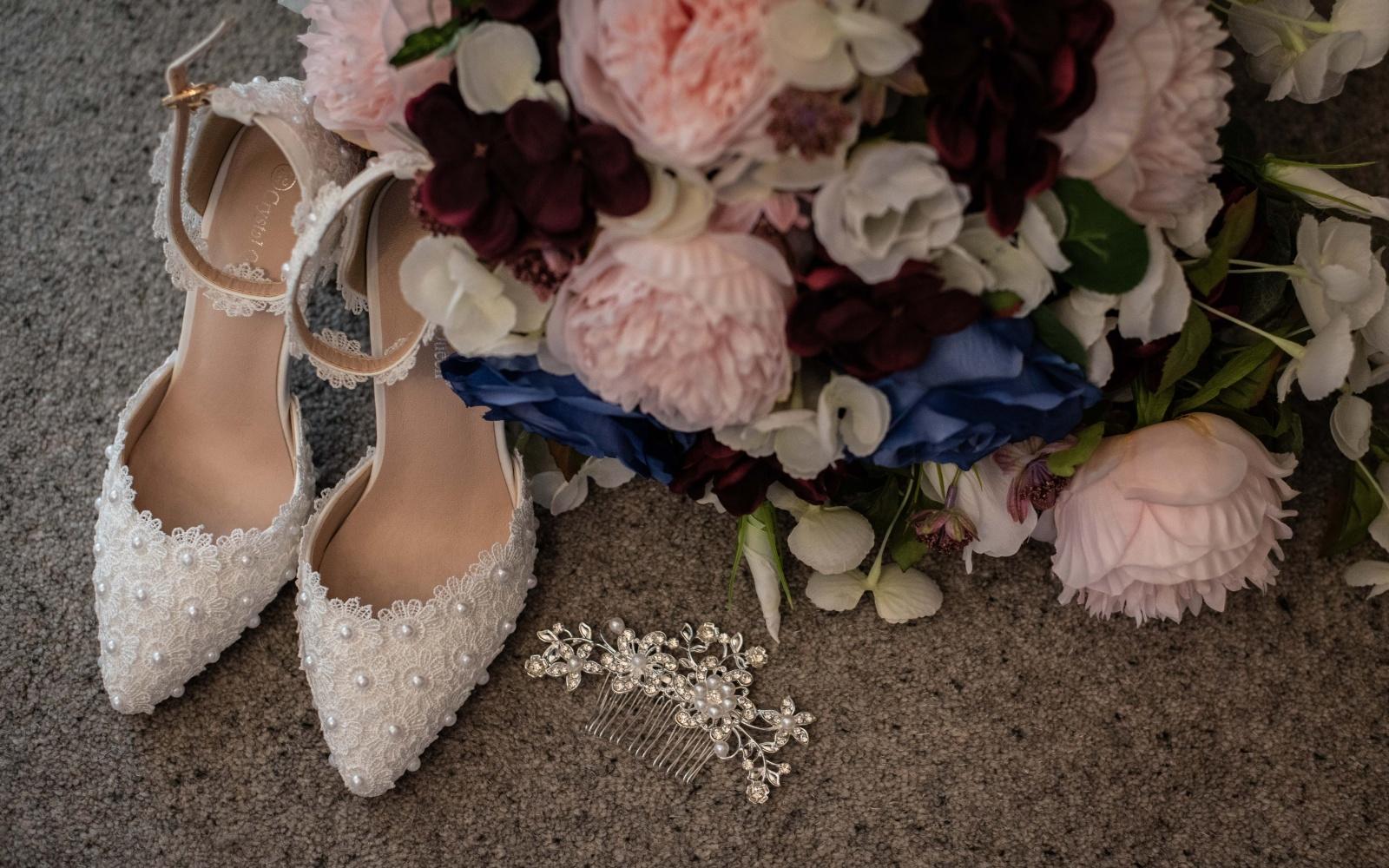 Real Wedding Strike A Pose Photography Wiltshire wedding photographer Kingscote Barn Tetbury Gloucestershire bridal shoes brides bouquet delicate hair slide