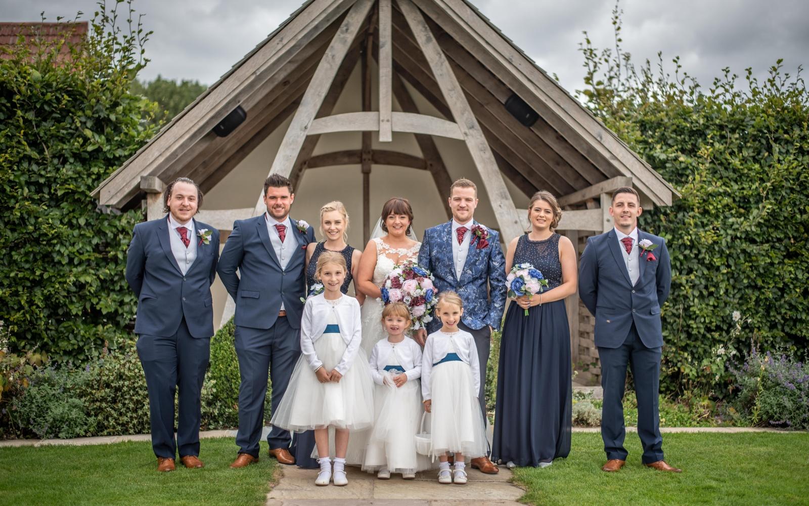 Real Wedding Strike A Pose Photography Wiltshire wedding photographer Kingscote Barn Tetbury Gloucestershire posed group photograph