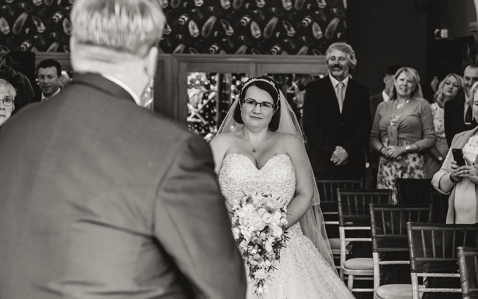 Capture Every Moment Real Wedding Photography Photographer duo Cirencester Hare and Hound Tetbury ceremony walking down the aisle 
