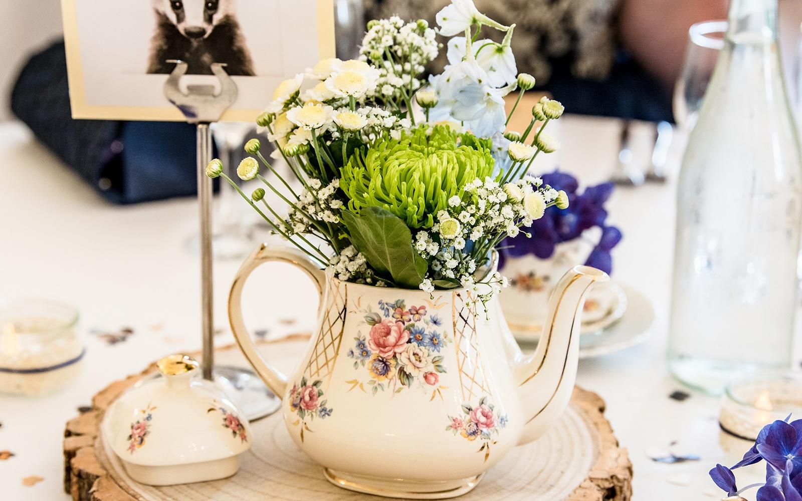 Capture Every Moment Real Wedding Cirencester photography Eastington Park Stonehouse Gloucestershire table center pieces vintage teapots with floral arrangements 