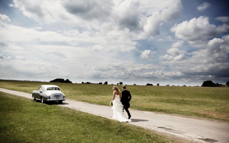 Old Lodge Whitewed Directory approved indoor outdoor wedding ceremony reception venue Cotswolds Minchinhampton Common Stroud Valley bride groom classic car portrait cloudy sky
