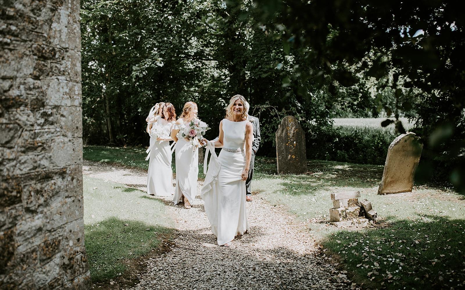 Real wedding Corky and Prince flowers florist stylist Gloucestershire Jenner's Barn Fairford Barn reception walking to the church ceremony