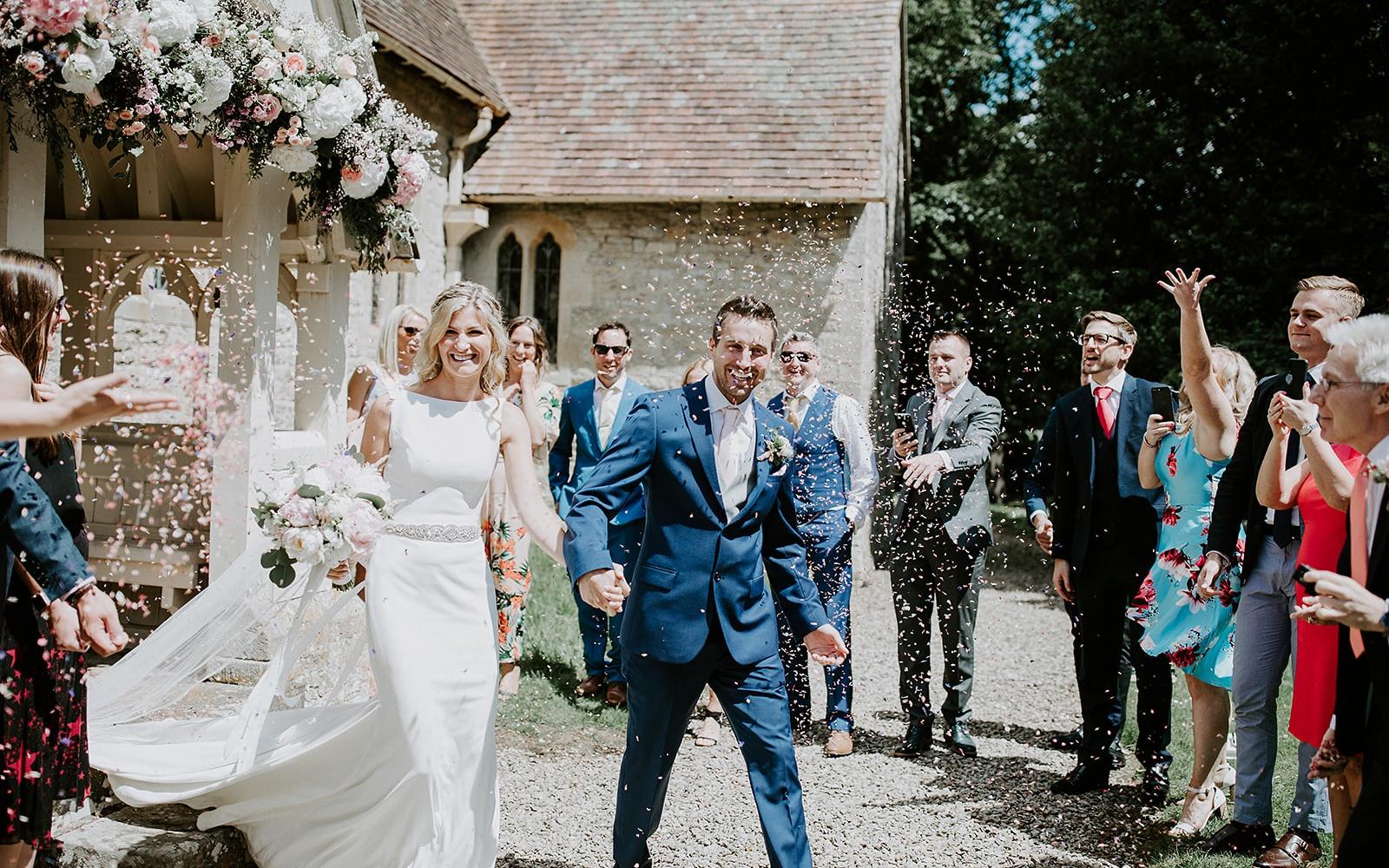 Real wedding Corky and Prince flowers florist stylist Gloucestershire Jenner's Barn Fairford Barn reception confetti shot just married