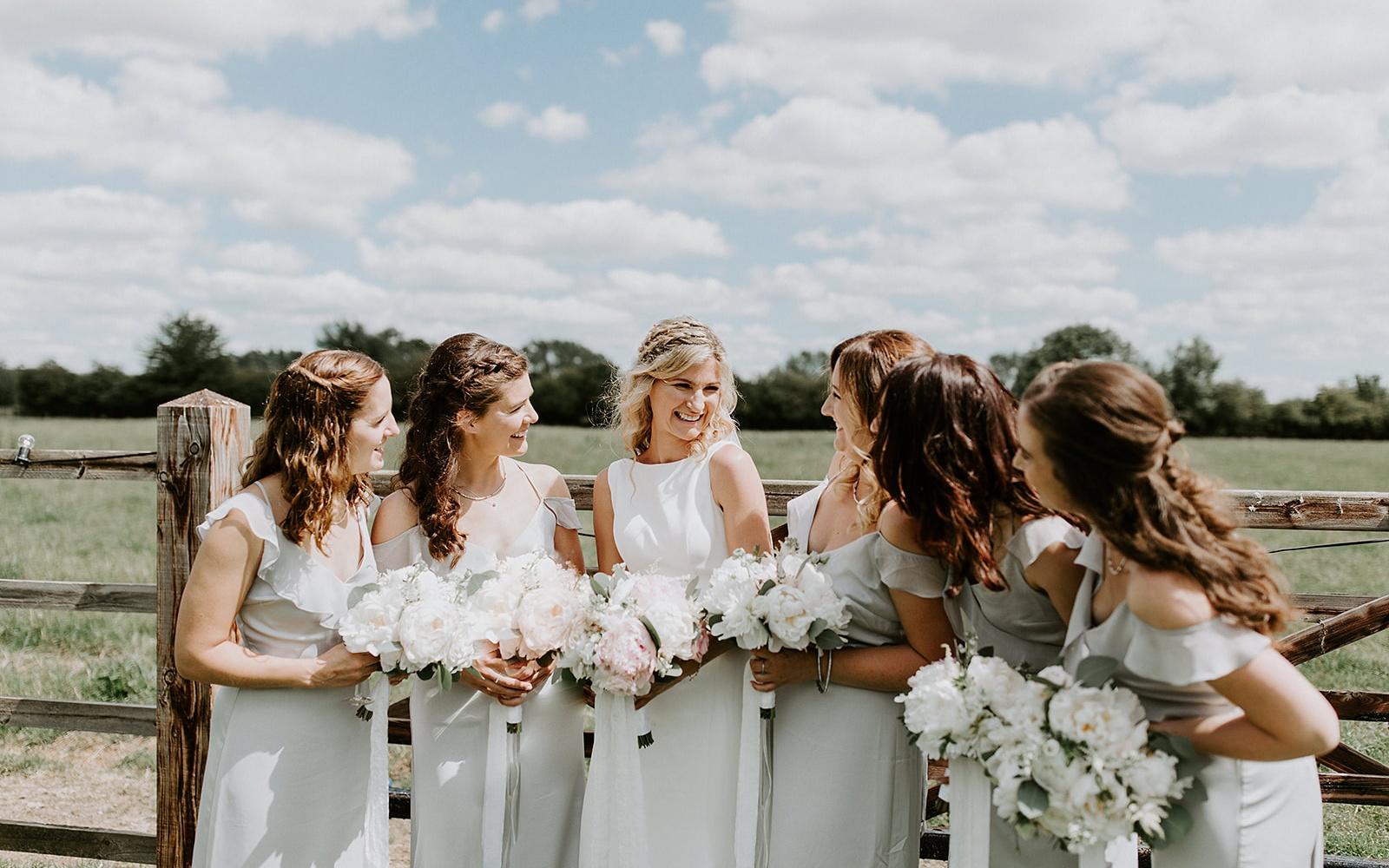 Real wedding Corky and Prince flowers florist stylist Gloucestershire Jenner's Barn Fairford Barn reception bride trip white bridesmaid dresses