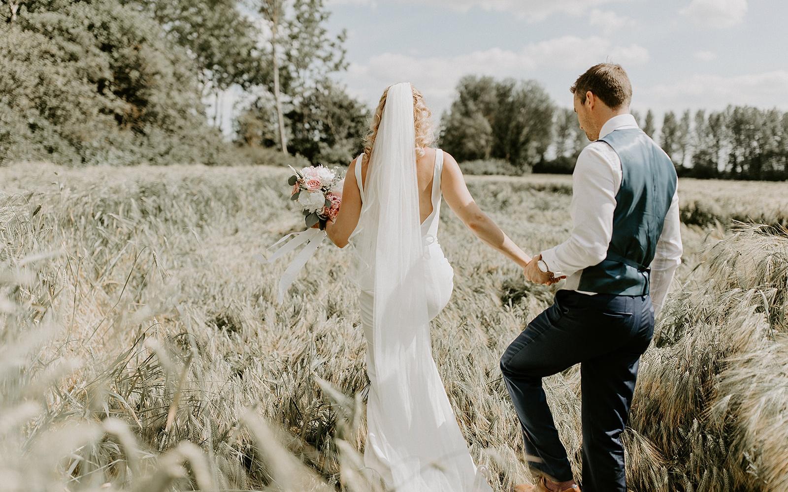 Real wedding Corky and Prince flowers florist stylist Gloucestershire Jenner's Barn Fairford Barn reception scoop back wedding dress