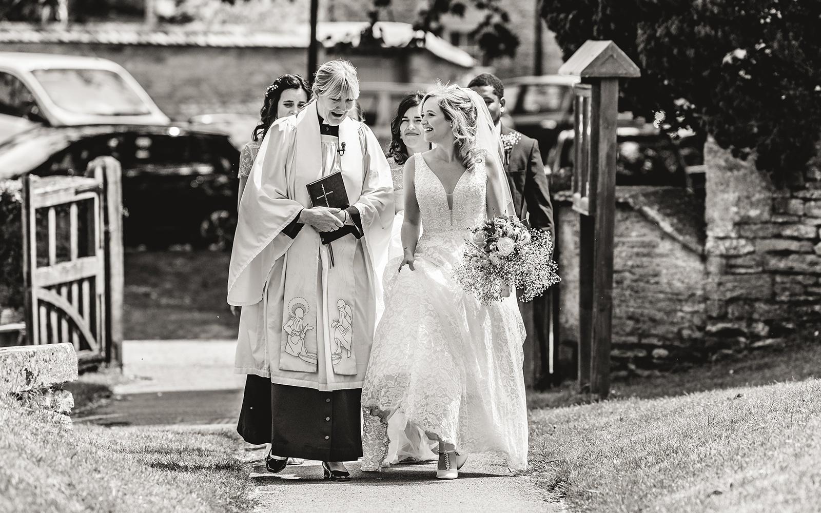 Capture Every Moment real wedding photography duo photographer Cirencester  Church of St Mary The Virgin Bampton Spittleborough Farm Wiltshire arrival at the church wedding ceremony