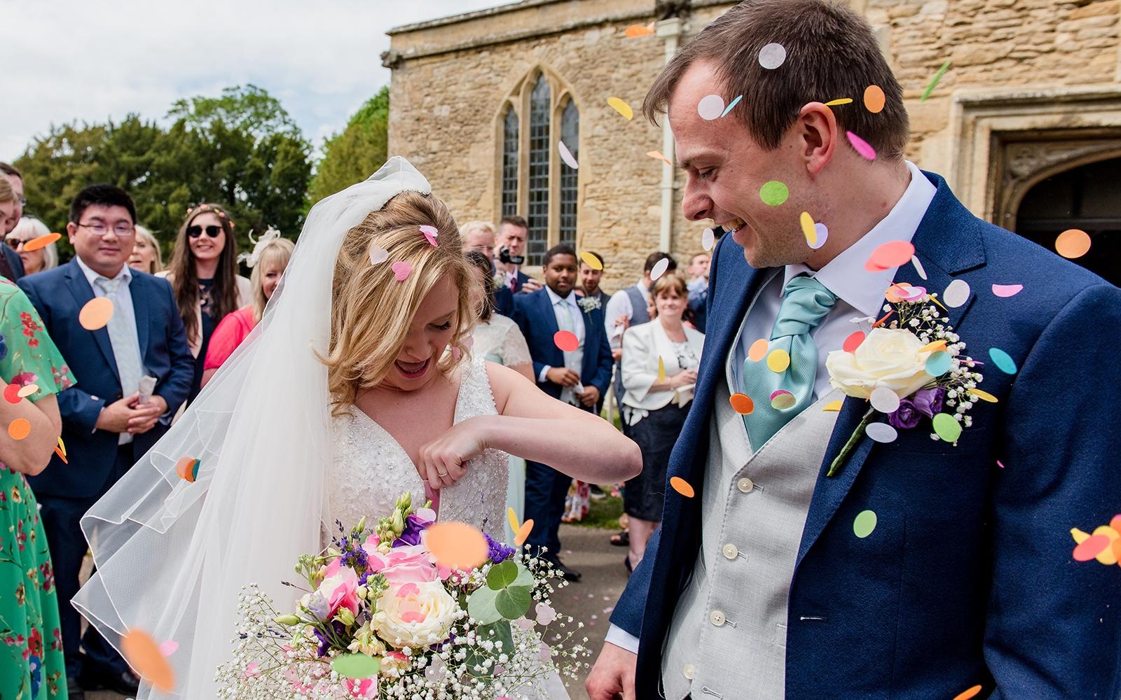 Capture Every Moment real wedding photography duo photographer Cirencester  Church of St Mary The Virgin Bampton Spittleborough Farm Wiltshire confetti shot