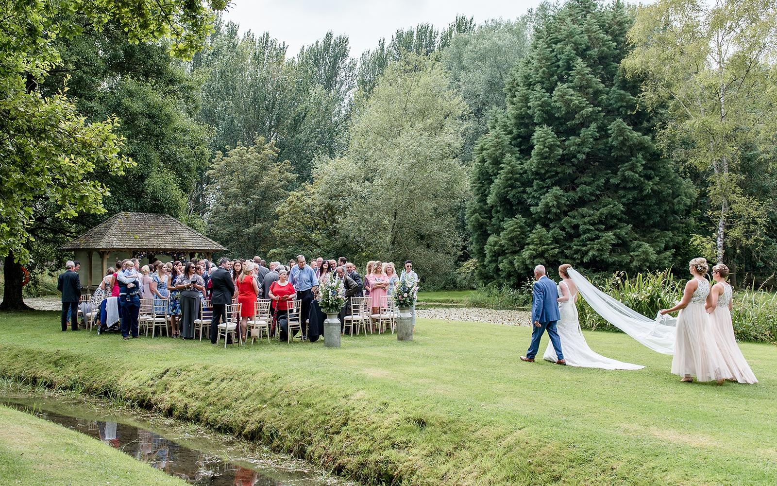 Capture Every Moment Cirencester based photography duo photographers Bittenham Springs wedding venue ceremony of island arrival of the bride