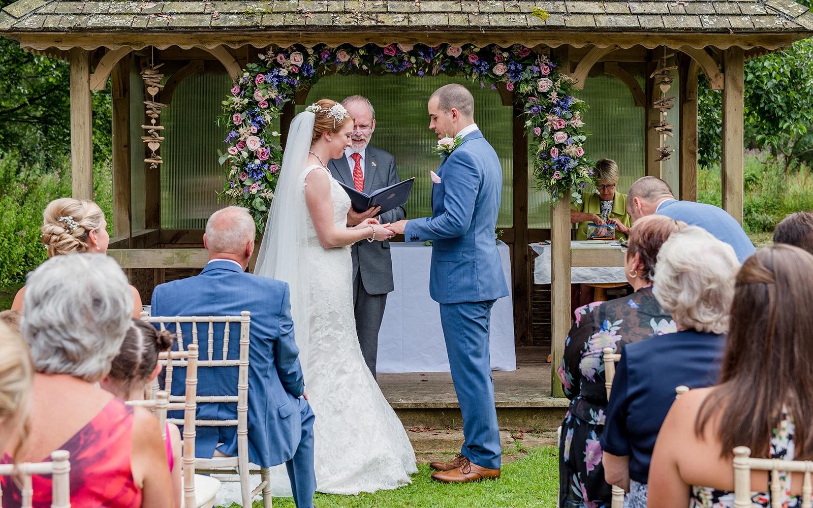 Capture Every Moment Cirencester based photography duo photographers Bittenham Springs wedding venue I do flower arch