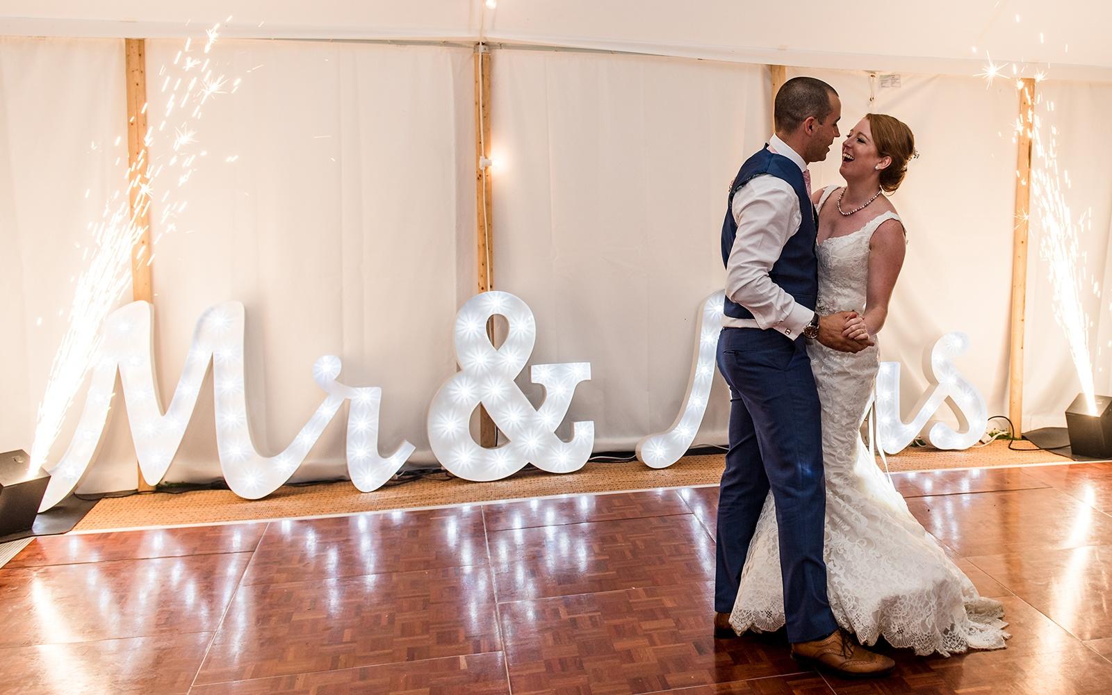 Capture Every Moment Cirencester based photography duo photographers Bittenham Springs wedding venue mr and mrs light up letters dance floor 